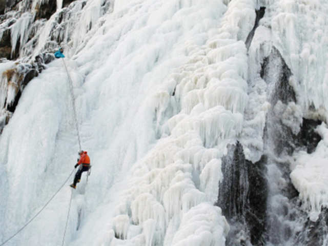 Ice climber on frozen water fall- 'Pissevache' 