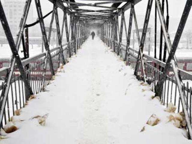 Snow-covered footbridge in Bucharest