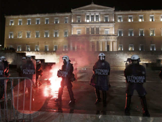 Police guard the parliament during a demonstration against anti-austerity measures in Athens