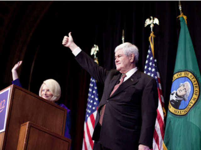 Newt Gingrich wave during a campaign