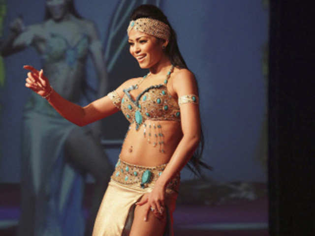 Miss India Worldwide contestant Eram Karim of India performs in talent portion of the pageant in Paramaribo