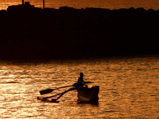 A fisherman rows his boat in Hambantota