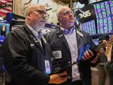 US stocks rise on strong jobs data, China trade talk optimism; Tesla rebounds