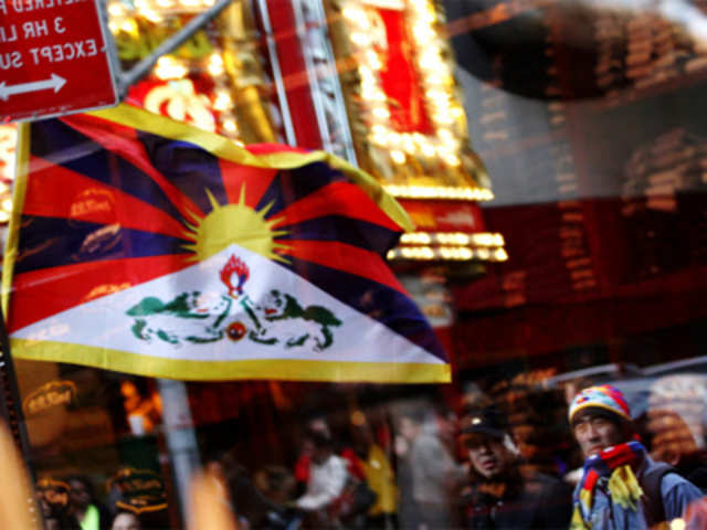 Demonstrators and a Tibetan flag