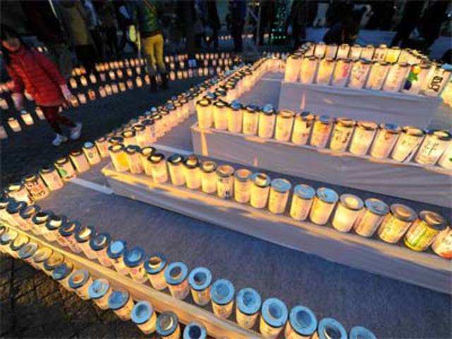 Candles with messages writen by children