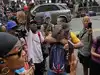 Video: Sean Diddy Combs' fans spray baby oil on each other in bizarre courthouse celebration