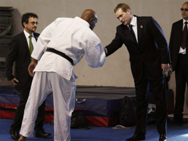 Browne shakes hand with a judo instructor 