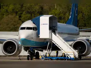 FILE PHOTO: FILE PHOTO: A Boeing jet intended for use by a Chinese airline returns to Boeing Field, in Seattle, Washington