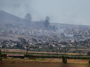 Israel strikes in Damascus as clashes between government forces and Druze groups in Syria rage on