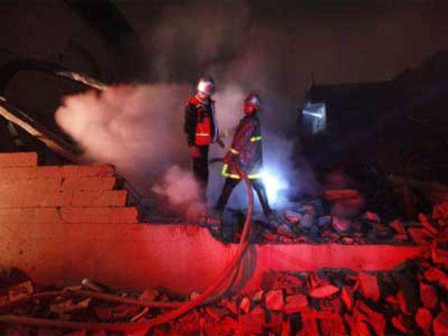 Fire fighters extinguish fire after Israeli air strike