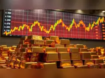 Gold dips as dollar firms, Trump's Powell remarks ease market jitters