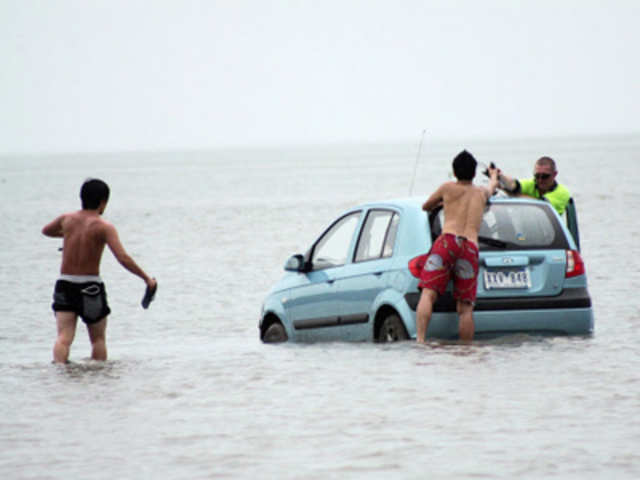 Car standed in the ocean
