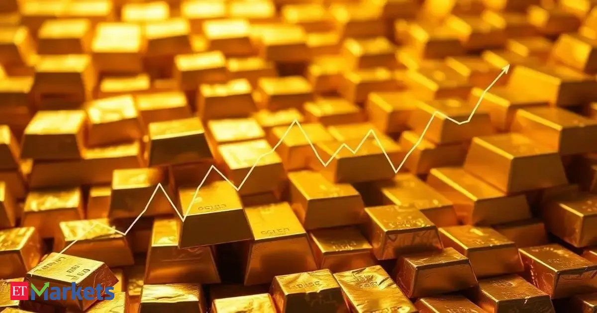 Gold ticks up on softer US dollar, heads for weekly gain