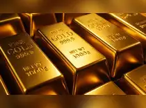 Gold edges down on stronger dollar, easing tariff concerns