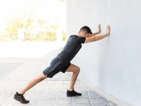 Calf stretch against wall