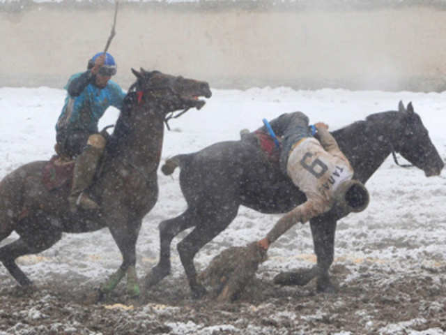 Kyrgyz riders play the traditional Central Asian sport Buzkashi