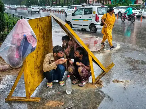 Workers take shelter in rain
