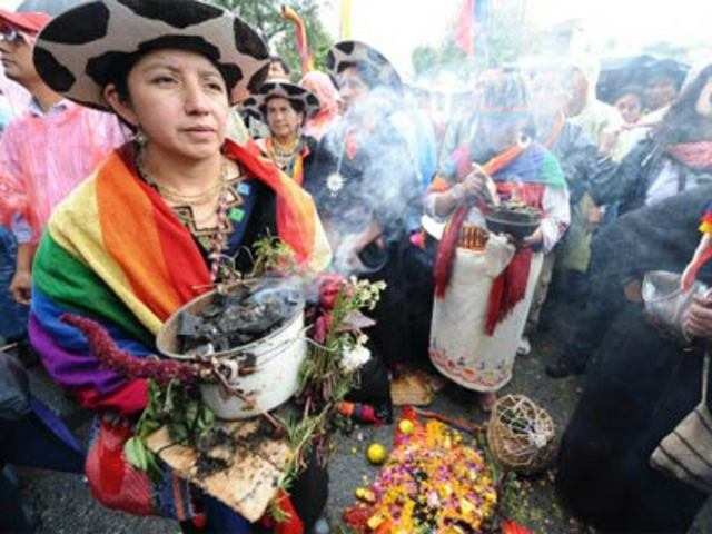 Indigenous women perform a ritual during a march