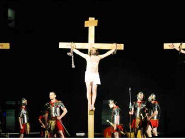 Actors re-enact the crucifiction of Jesus Christ