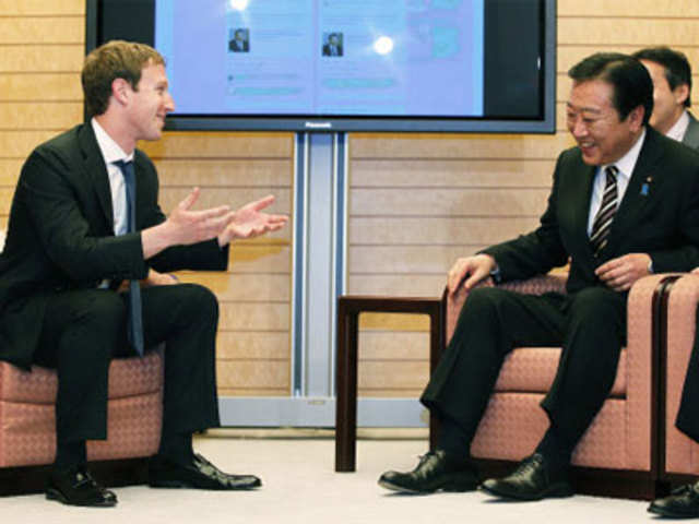 Zuckerberg shares a light hearted moment with Noda