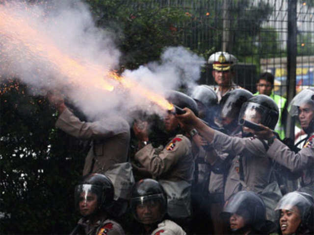 Police officers fired tear gas launchers to disperse protesters