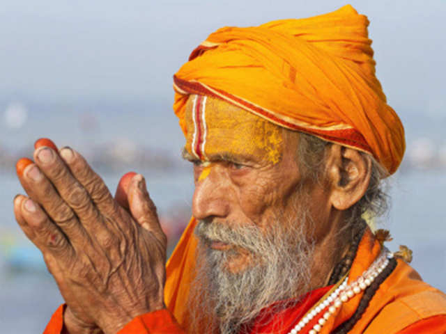 A Hindu holy man offers prayers after taking a dip in the River Ganges during the Hindu festival of Navratri 