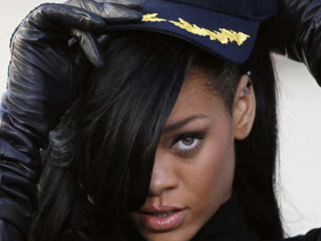 Rihanna wears a cap during a news conference to promote the film 'Battleship'