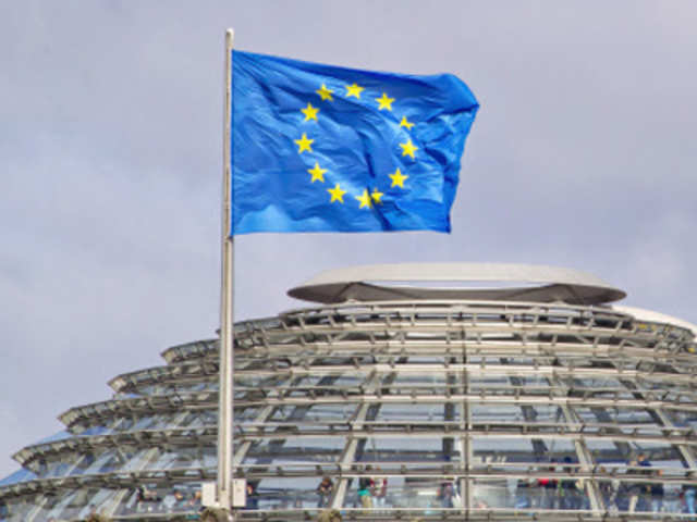 European Union flag flies above cupola of Reichstag building in Berlin