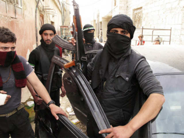 Free Syrian Army fighters are seen in a neighborhood of Damascus, Syria