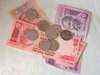 Rupee weakens on local shares, dollar gains