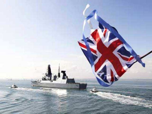 A union flag is waved as HMS Dauntless leaves port in Portsmouth