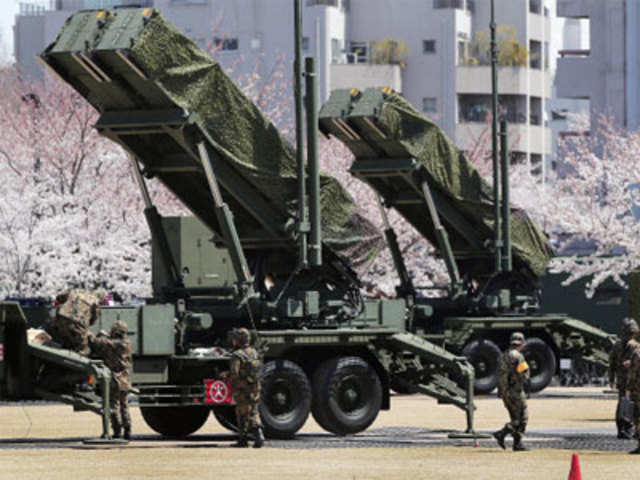 Japanese personnel prepare to set PAC-3 Patriot missile unit