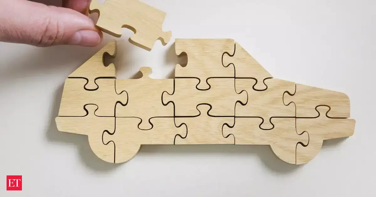 A modern car dashboard displaying digital screens with connected features and safety alerts.