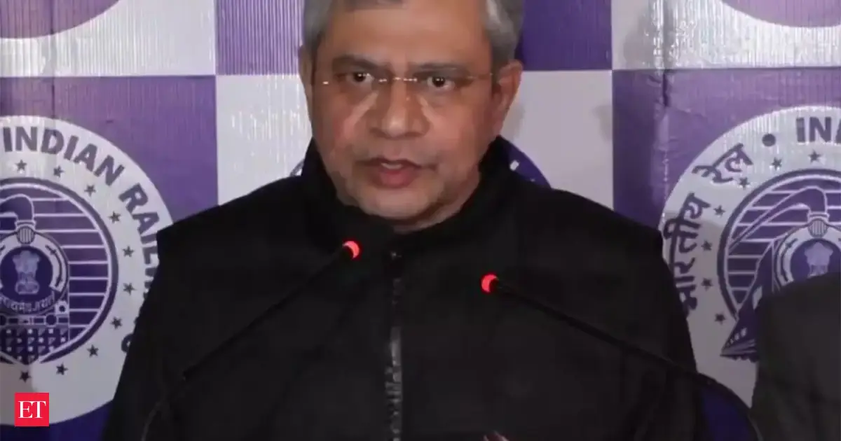 AI system inspecting railway tracks with a train in the background, symbolizing future maintenance.