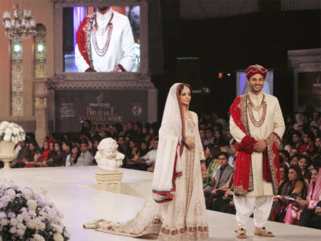 Pakistani models present a creation by designer Nadia Chhotani