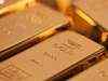 Gold edges down with euro; Spain bond auction in focus