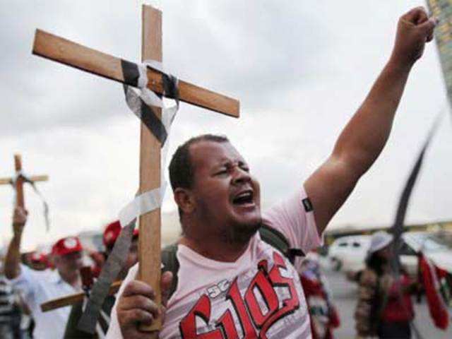 MST hold up crosses during a protest in Brasilia