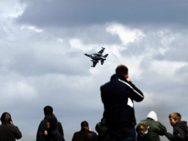 Aircraft spotters enjoy as a fighter pass above Leeuwarden