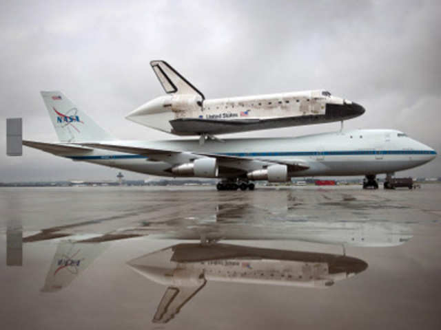 US Space shuttle Discovery mounted atop NASA 747 Shuttle Carrier