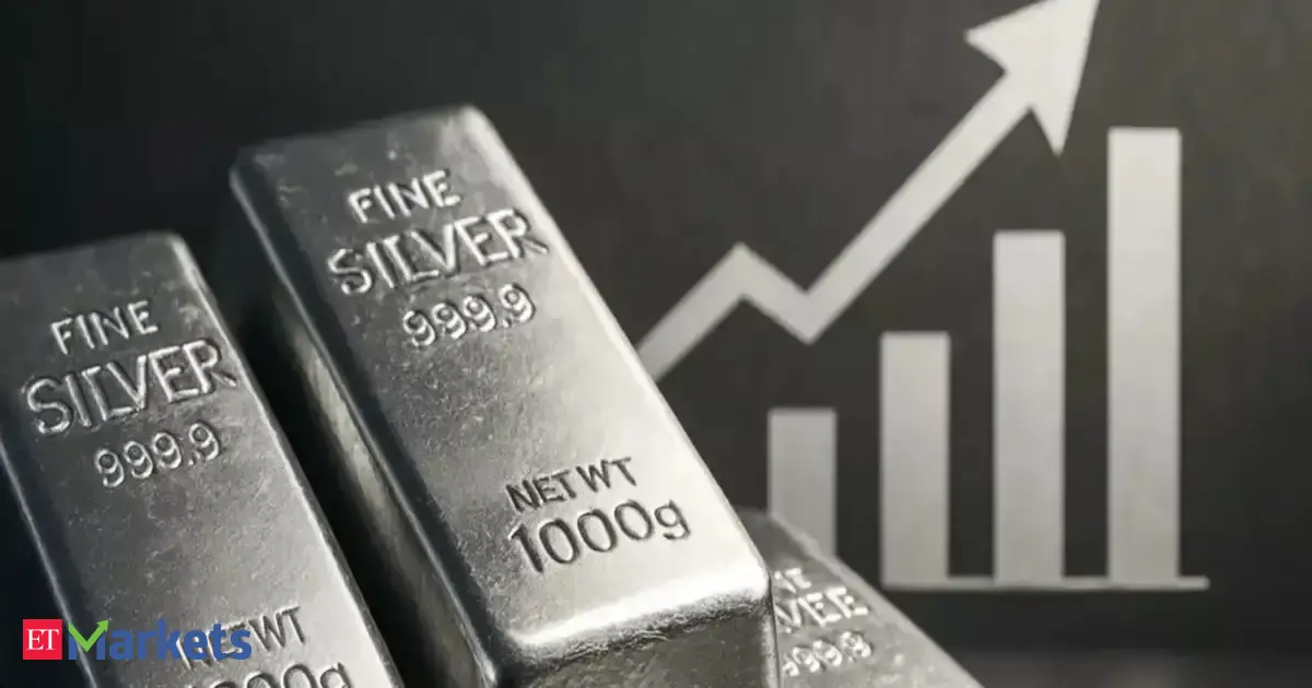 Silver hits $100 an ounce for the first time in international markets; gold hits fresh record