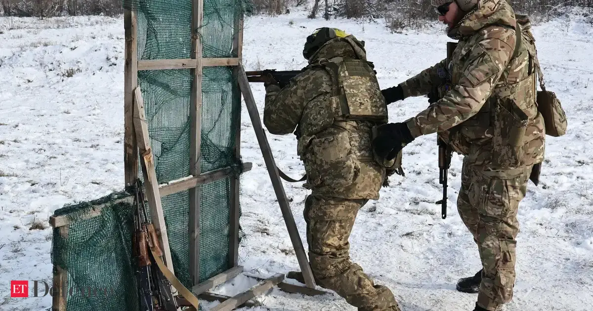 Ukraine's two largest cities under Russian attack, officials say one dead