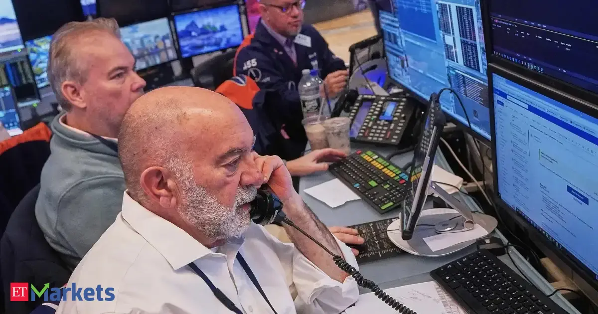 Stock market charts showing muted futures and a tech rebound, with a focus on upcoming economic data.