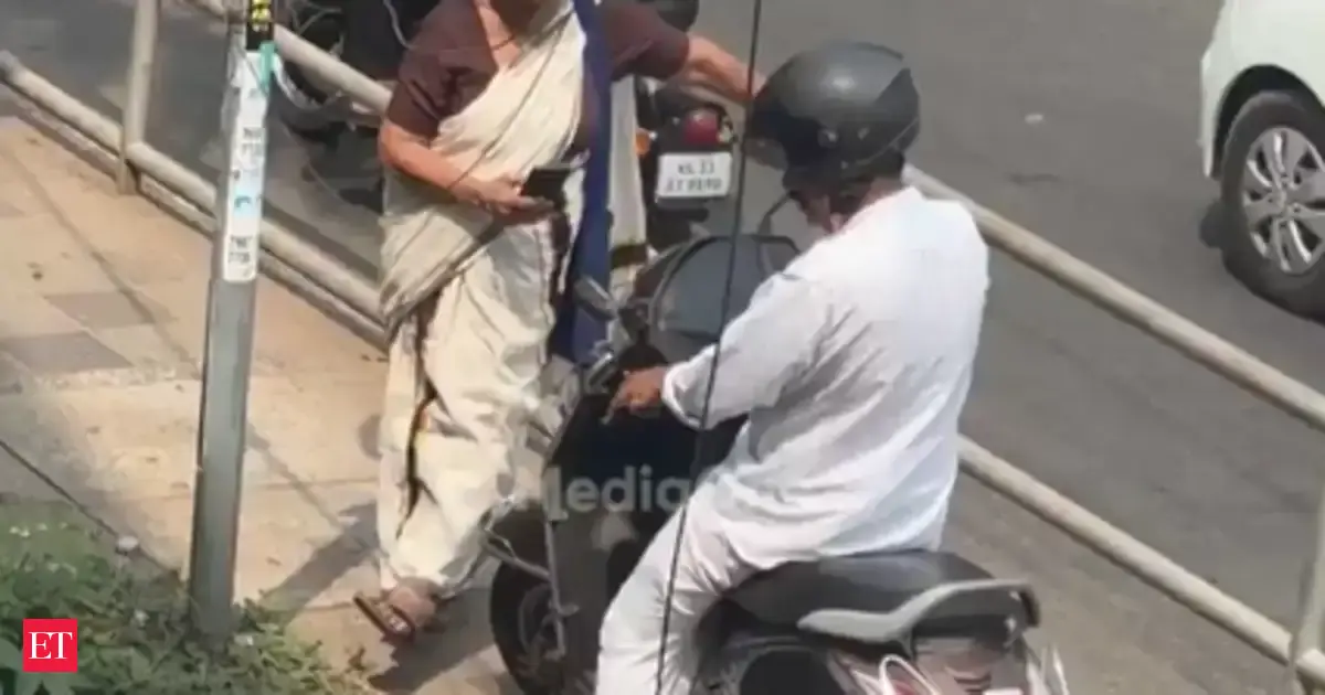 Elderly woman in Kerala stops scooty rider from driving on footpath ...