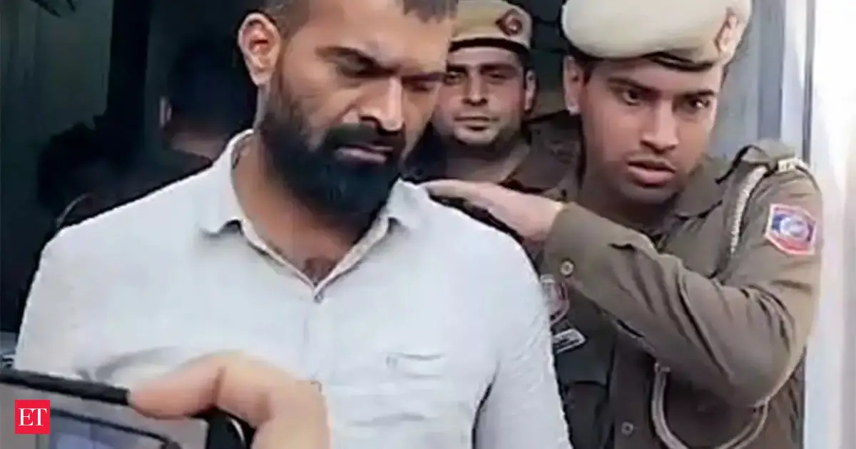 Four Indian Youth Congress workers protesting shirtless at an AI Impact Summit, being arrested.