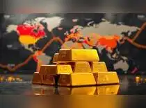 Gold falls from three-week high as dollar firms - The Economic Times