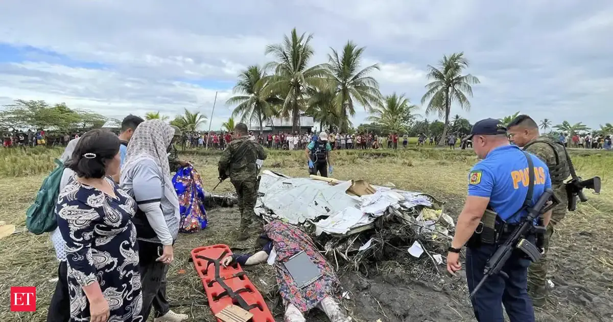 US military plane crashes into road barrier in Philippines, 5 injured