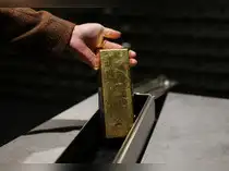 Gold slides below $5,000, drops to over one-month low