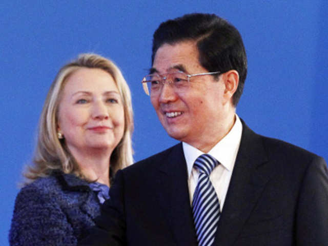 US Secretary of State Hillary Rodham Clinton looks at Chinese President Hu Jintao