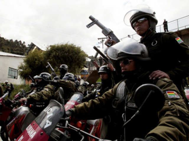 Riot policemen patrol during a protest in La Paz