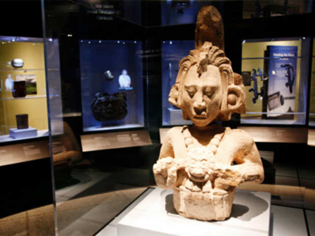 A stone figure of the Maize God at the Maya 2012